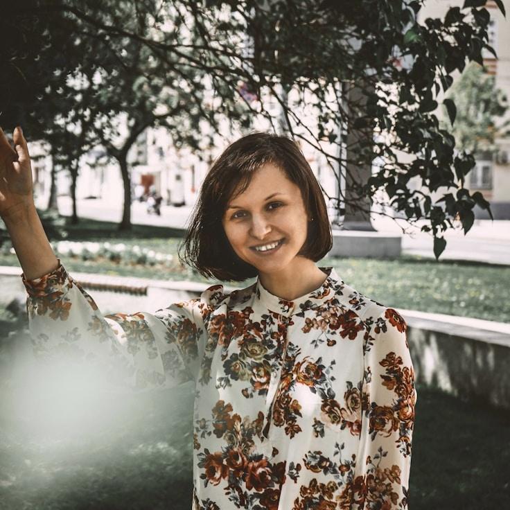 Asha Singh, Lead Design Curator at TrailGatherWindow, reviewing corporate floral arrangements